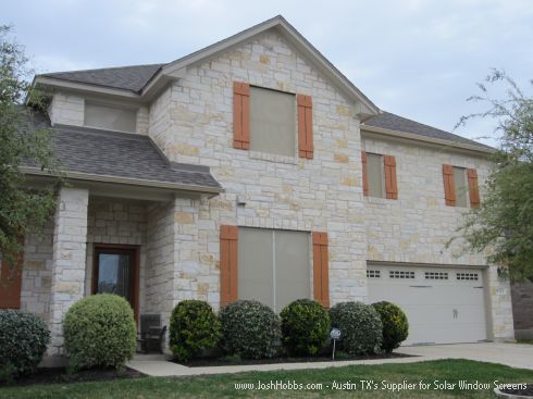 Beige Solar Screens on an Austin Limestone House.